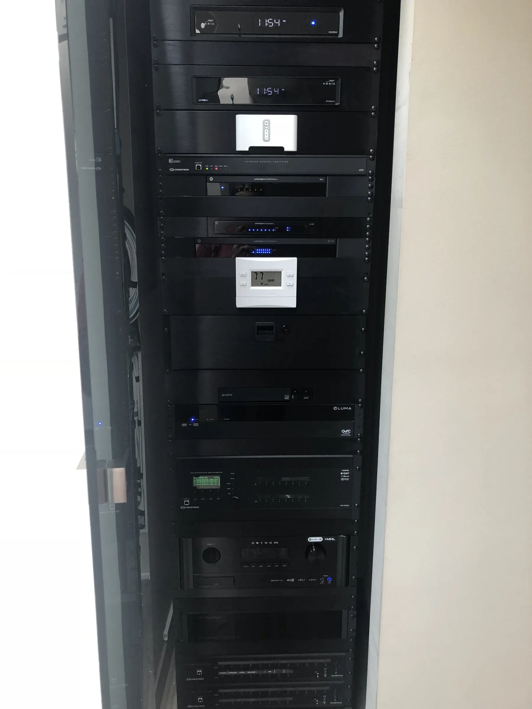 Equipment rack recessed into a wall niche